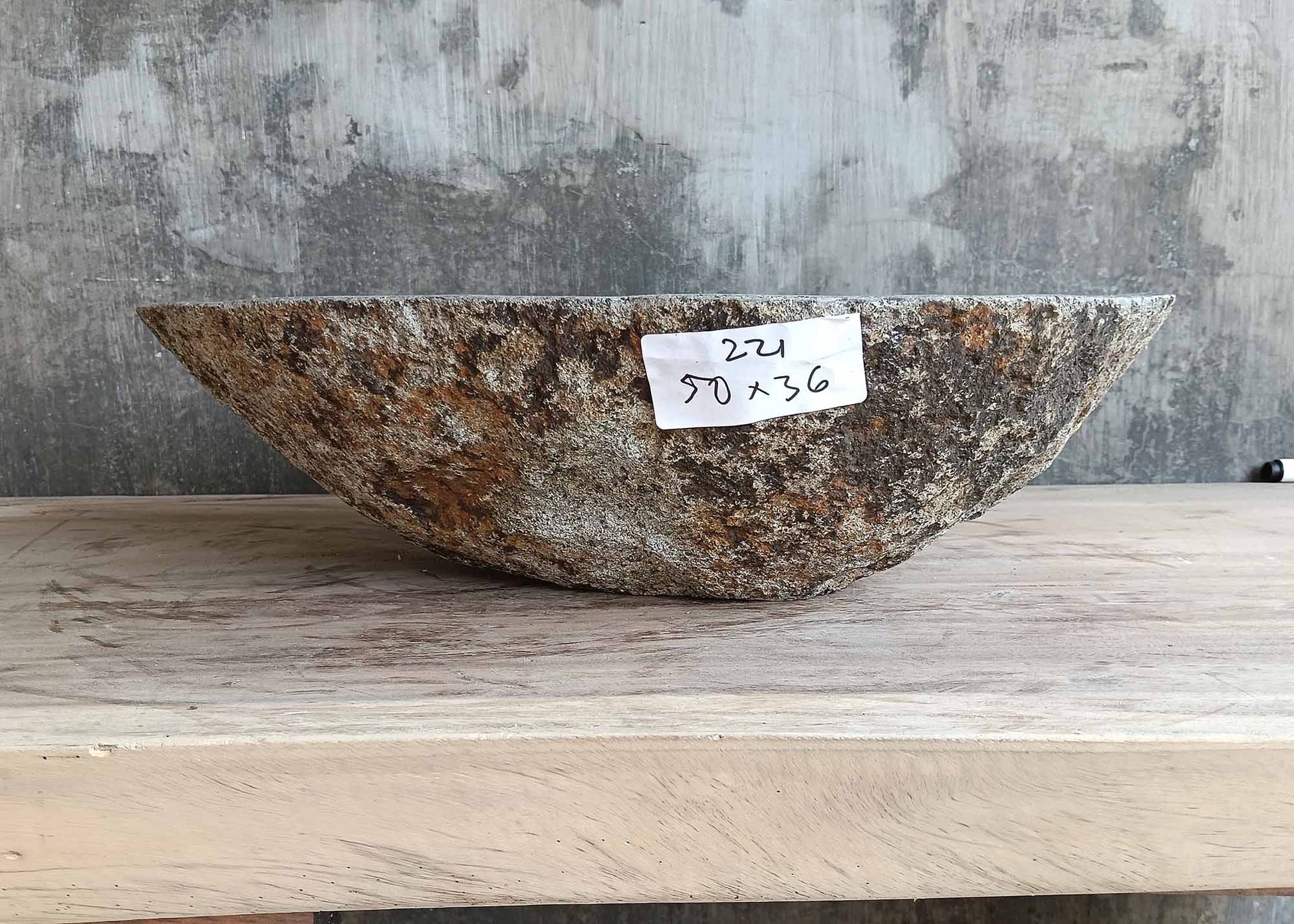 Front profile of handcrafted stone sink 6221-5036 with raw brown-gray exterior
