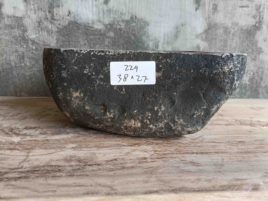 Right side view of 15×11 inch grey river stone sink in irregular form
