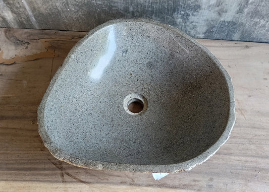 Top view of 18×16 inch river stone sink with rounded triangular shape and polished light gray interior
