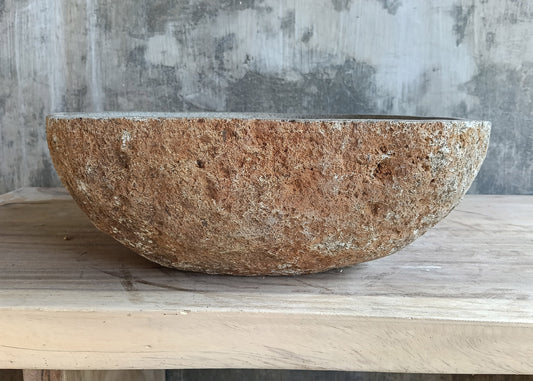 Front side of 18×16 inch sink showing reddish outer surface and curved triangular profile

