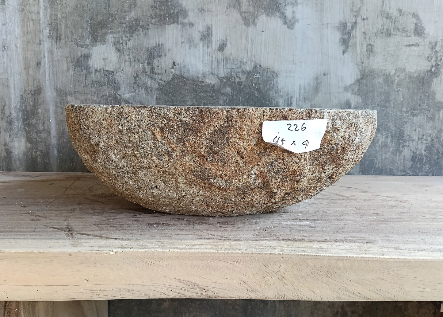 Left side of river stone sink 18×16 inch with sculpted contour and two-tone finish
