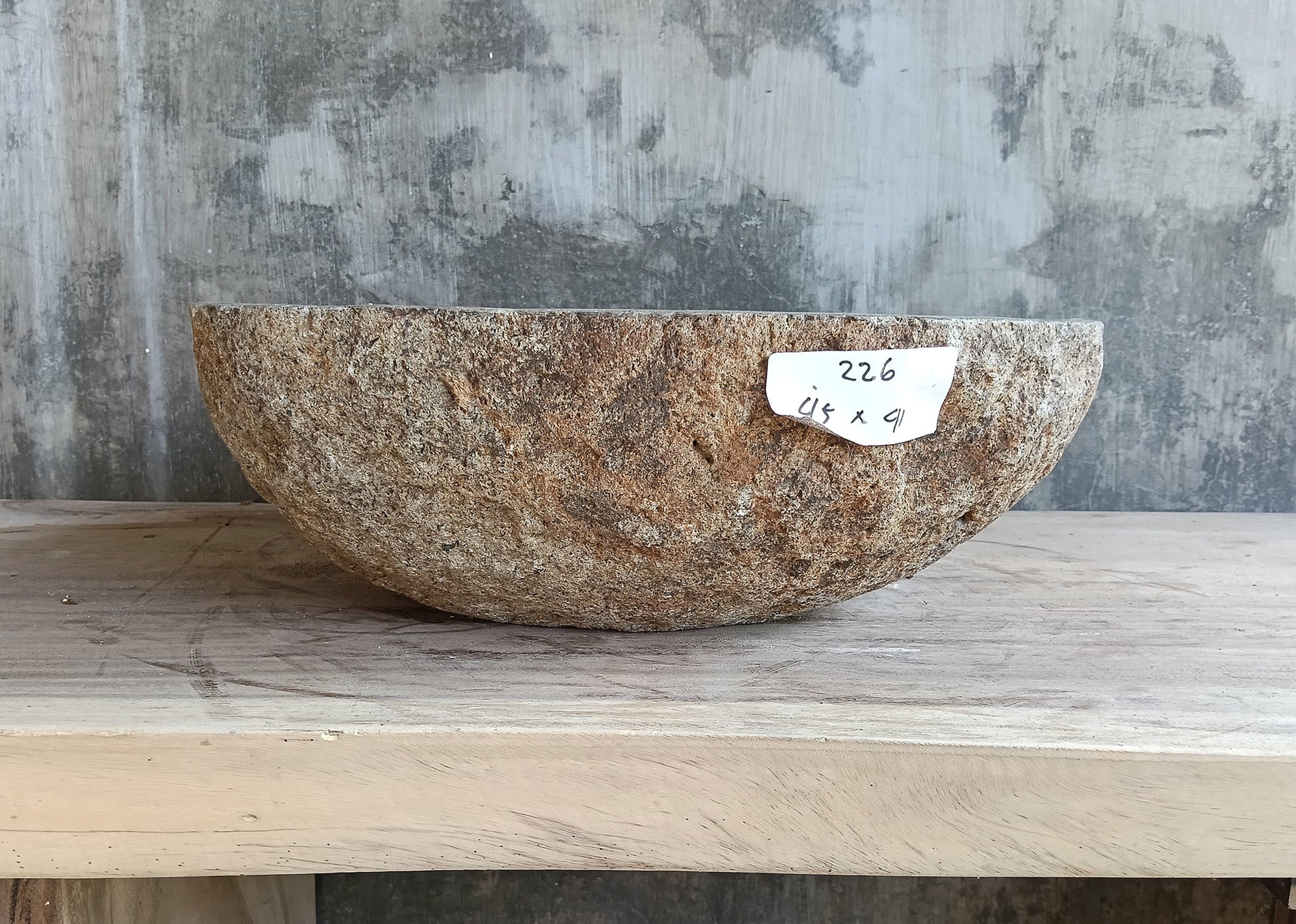 Left side of river stone sink 18×16 inch with sculpted contour and two-tone finish
