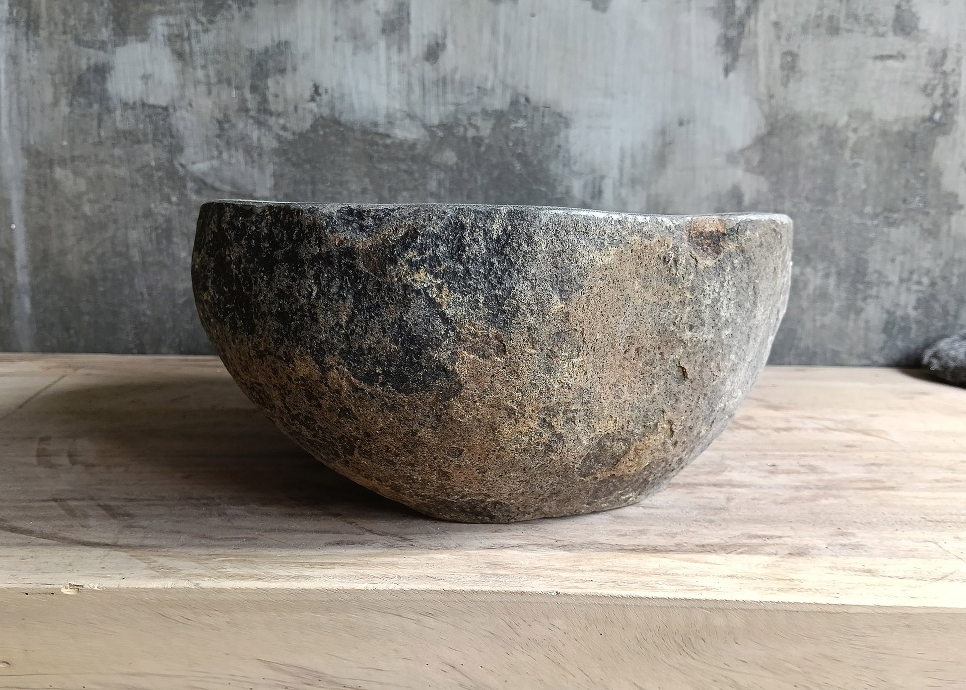 Right side view of 16×12 handcrafted sink highlighting smooth curves and stone texture
