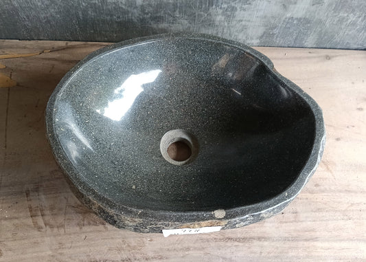 Top view of 16×12 inch dark gray river stone sink with smooth oval shape and polished interior
