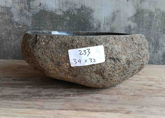 Right side view of 13×13 inch grey-brown river stone sink installed in countertop
