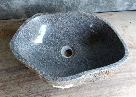 Top view of 19x13 inch irregular gray river stone sink with polished bowl
