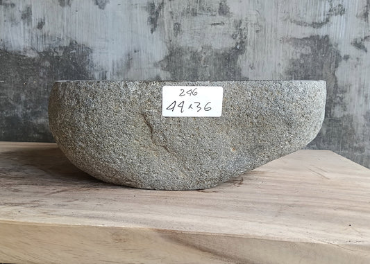 Front view of gray stone bathroom sink showing raw exterior texture
