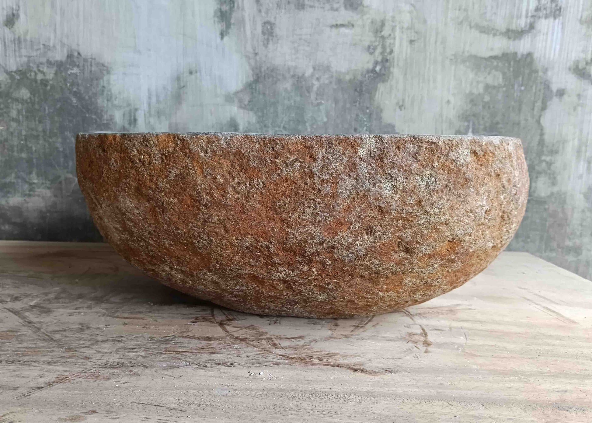 Left side view of 15×13 inch grey river stone sink showing boat-like profile
