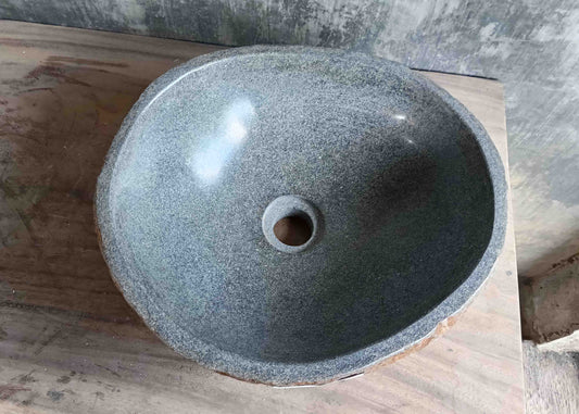 Top view of handcrafted grey 15×13 inch river stone sink in oval boat-like form
