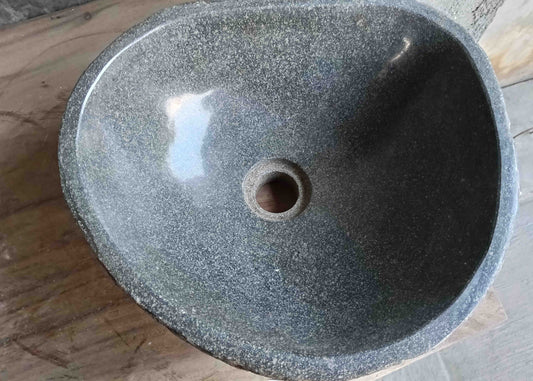 Top view of handcrafted grey 14×13 inch river stone sink in oval boat-like form
