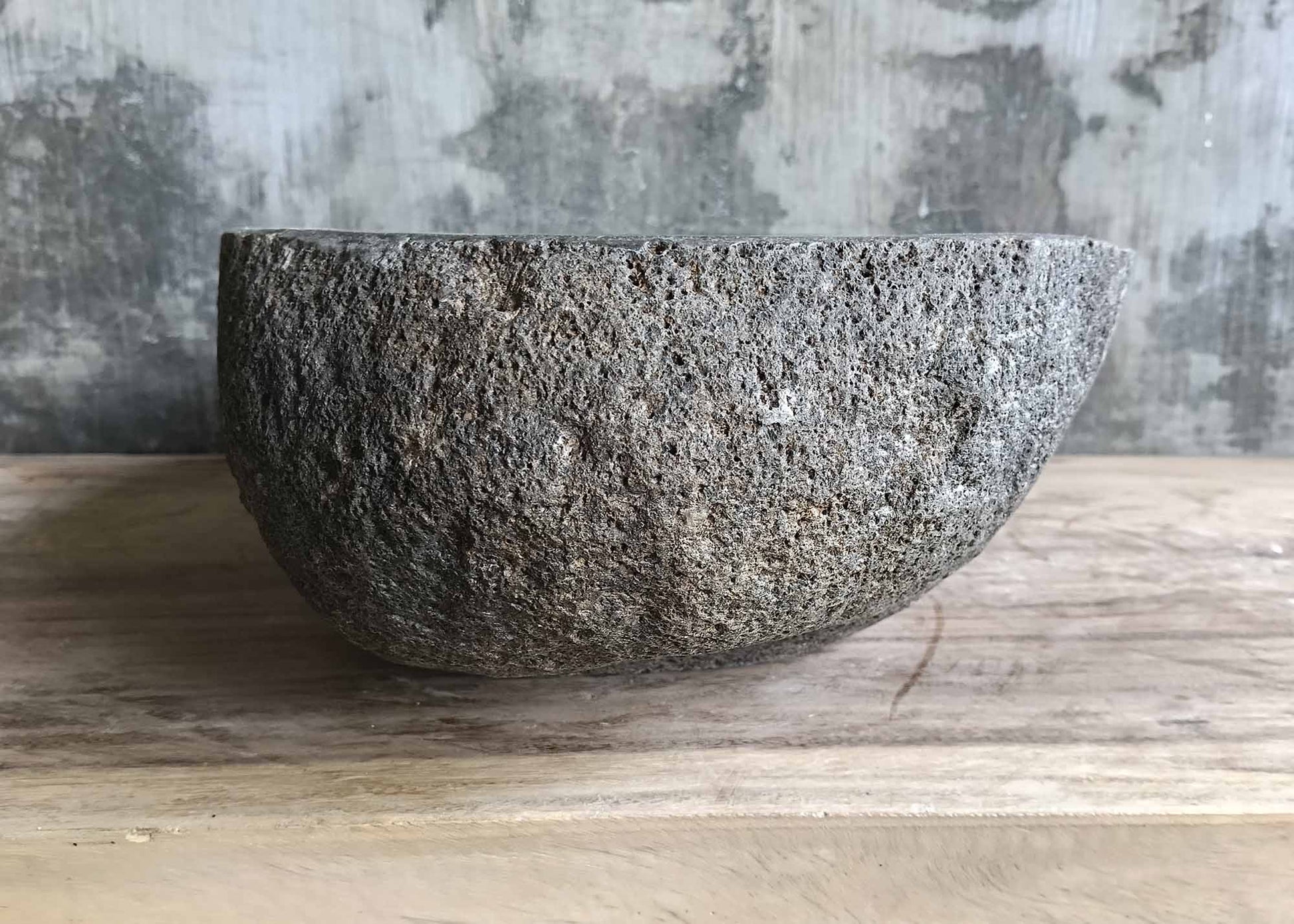 Left side view of sink 6275-5230 with soft curves and thick river stone walls

