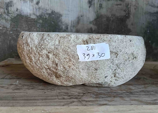 Right side view of 15×12 inch light-gray river stone sink installed in countertop

