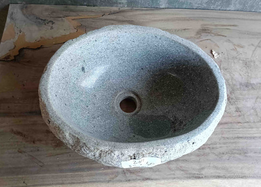 Top view of exclusive light-gray 15×12 inch river stone sink in smooth oval form
