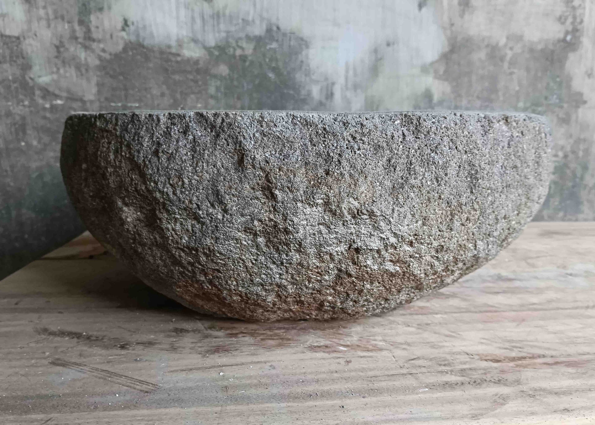 Left side view of 15×13 inch grey river stone sink showing boat-like profile
