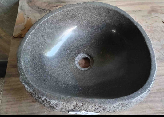 Top view of handcrafted grey 15×13 inch river stone sink in oval-triangle form
