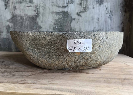 Front view showing uneven profile of handcrafted dark stone sink
