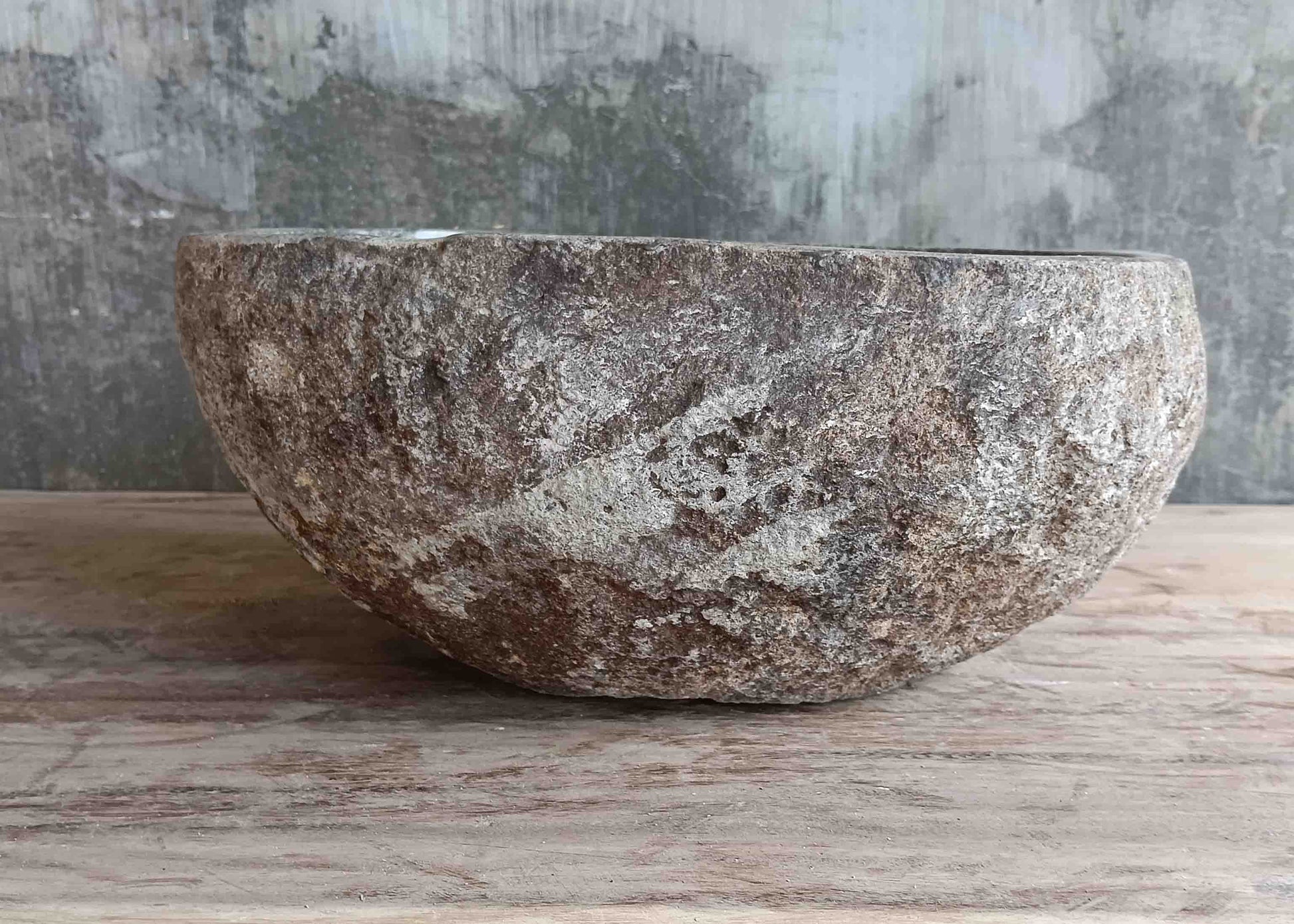 Left side view of 13×12 inch light-gray river stone sink showing boat-like profile
