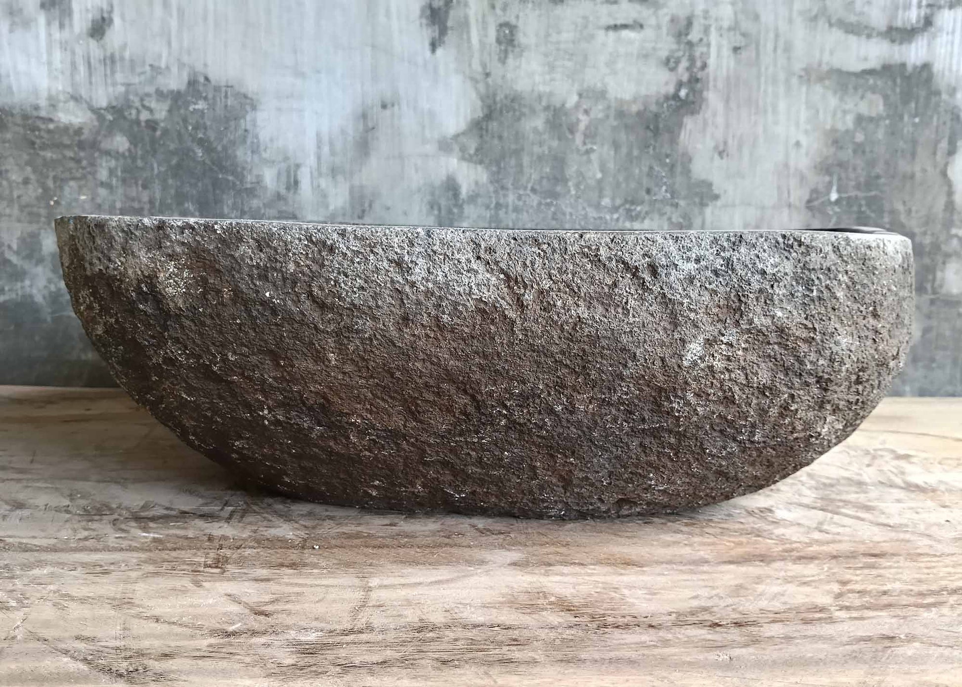 Right profile of irregular handcrafted graphite sink
