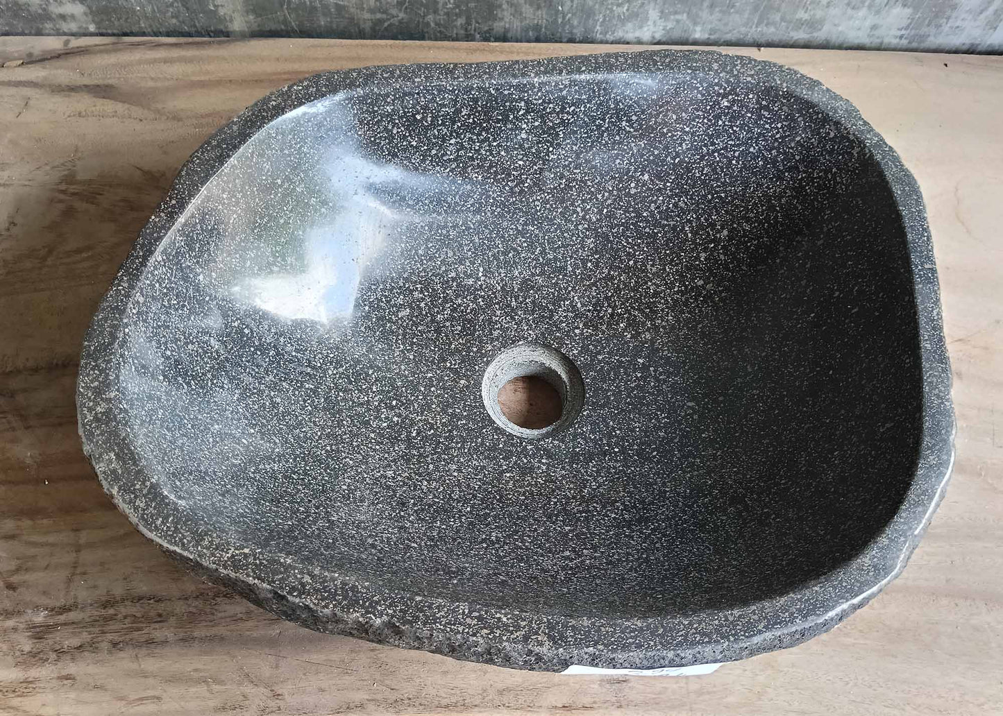 Top view of handcrafted graphite river stone sink with angular shape

