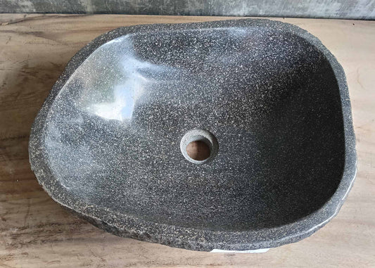 Top view of handcrafted graphite river stone sink with angular shape
