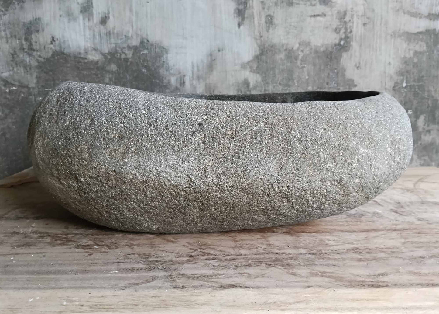 Front view showing smooth barrel-style profile of stone sink
