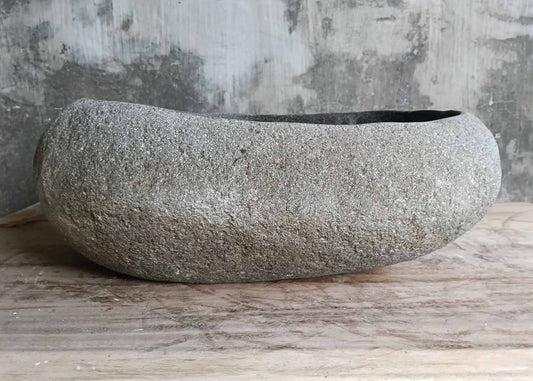 Front view showing smooth barrel-style profile of stone sink
