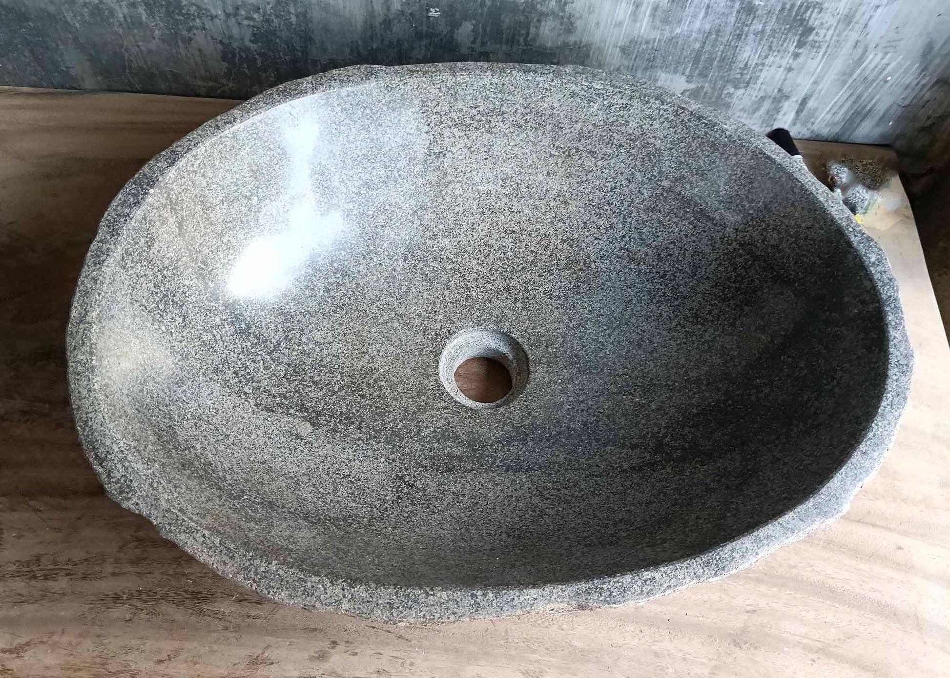 Top view of river stone sink 6309-5037 with polished light gray oval bowl and fine grain texture
