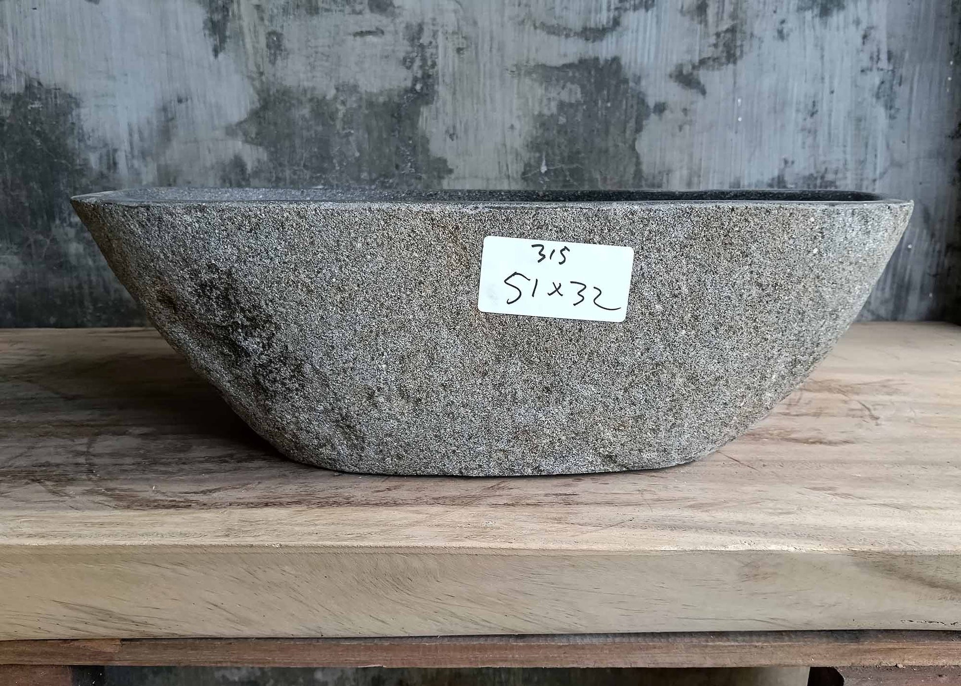 Front side of handcrafted sink 6315-5132 showing smooth contours and raw stone texture
