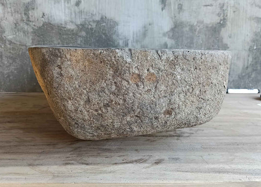Right side view of 14×17 inch dark black river stone sink in irregular shape
