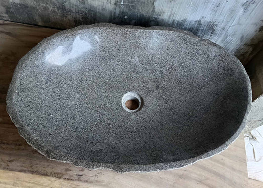 Top view of river stone sink 6241-6342 with polished light gray oval bowl and soft grain pattern
