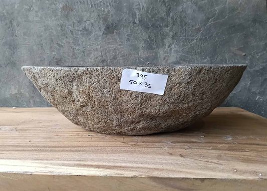 Front view of sink 6345-5036 with smooth oval silhouette and raw stone shell
