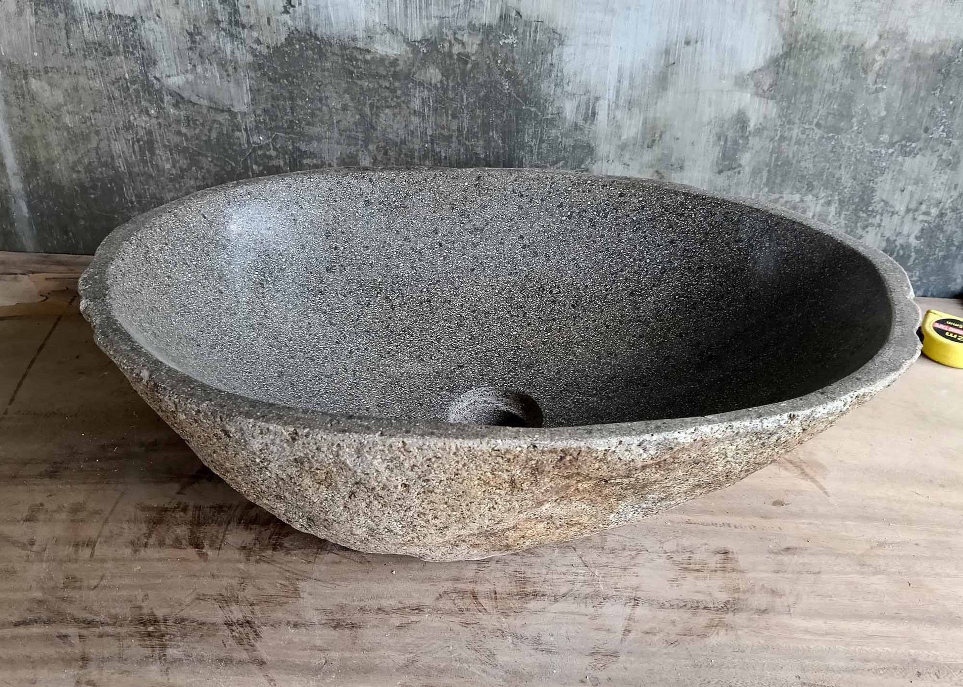 Back profile of handcrafted river stone sink 6345-5036 showing beige-gray textured exterior
