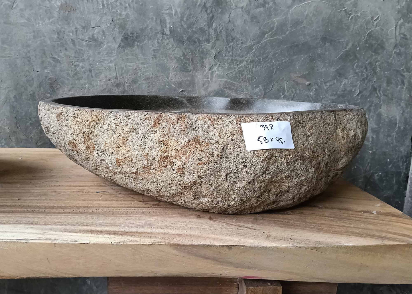 Front profile of handcrafted sink 6347-5845 with thick rugged stone texture and rounded form
