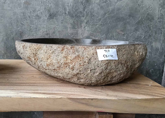 Front profile of handcrafted sink 6347-5845 with thick rugged stone texture and rounded form
