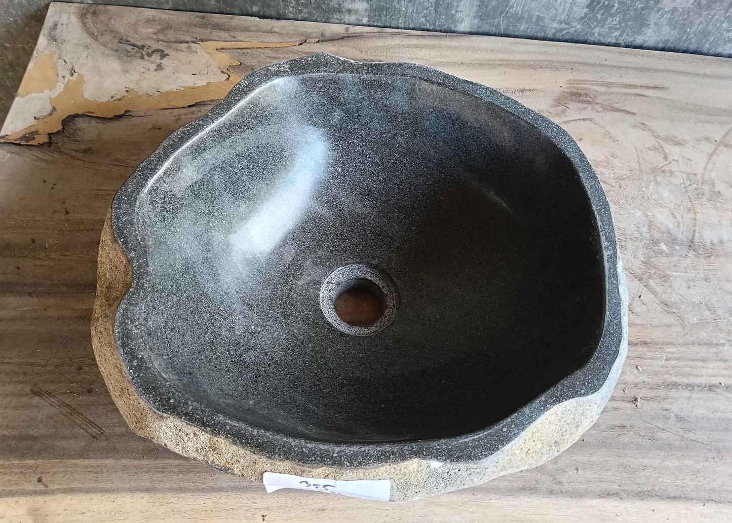 Top view of handcrafted dark gray 15×14 inch river stone sink
