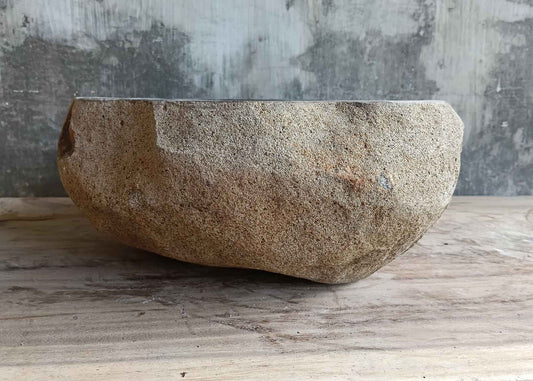 Right side view of 15×14 inch dark gray river stone sink in rounded boat shape
