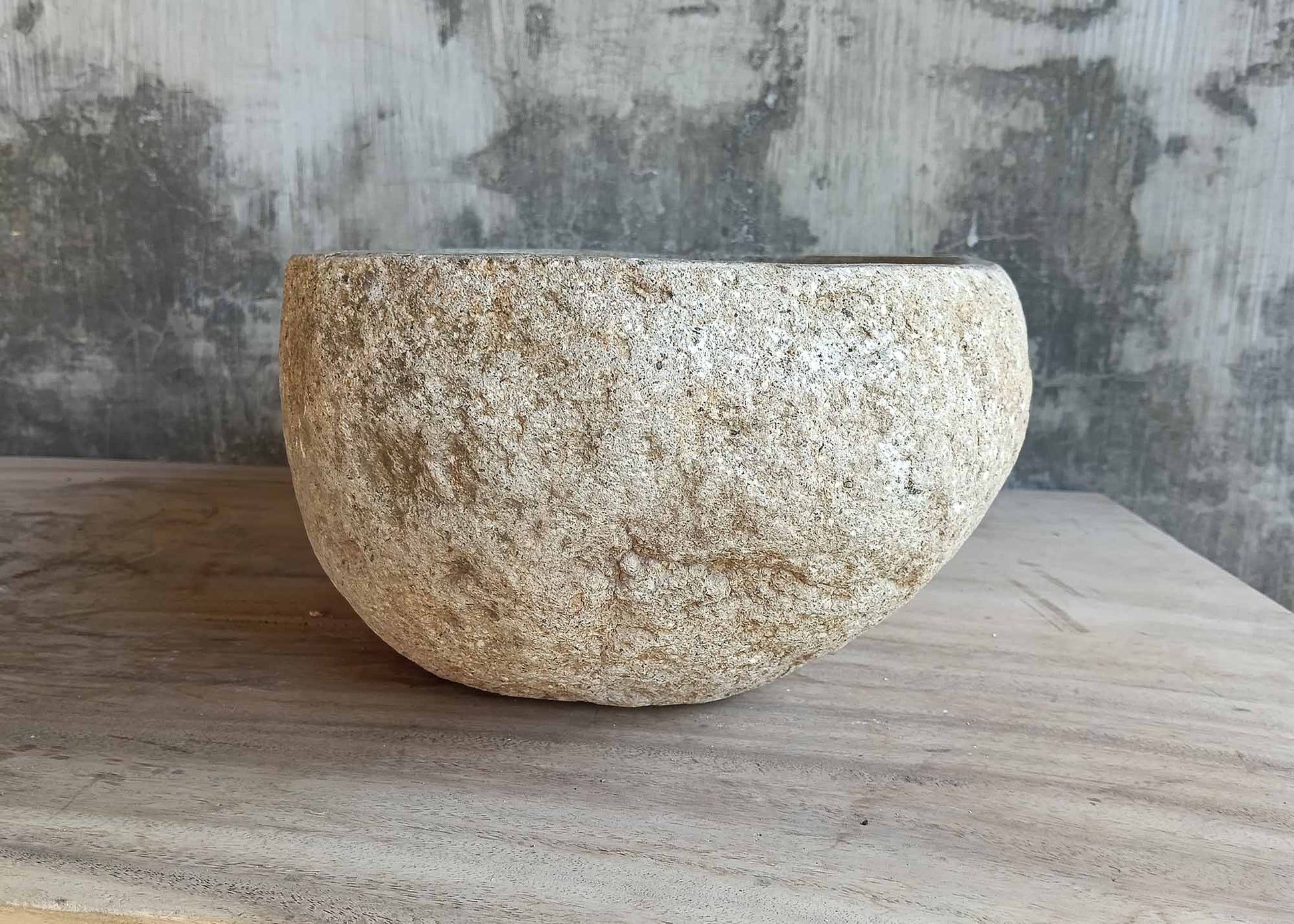 Right angle view of smooth-edged beige river stone basin – 6367


