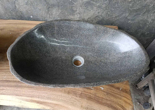 Top view of river stone sink 6373-6136 with elongated oval bowl and polished dark gray finish
