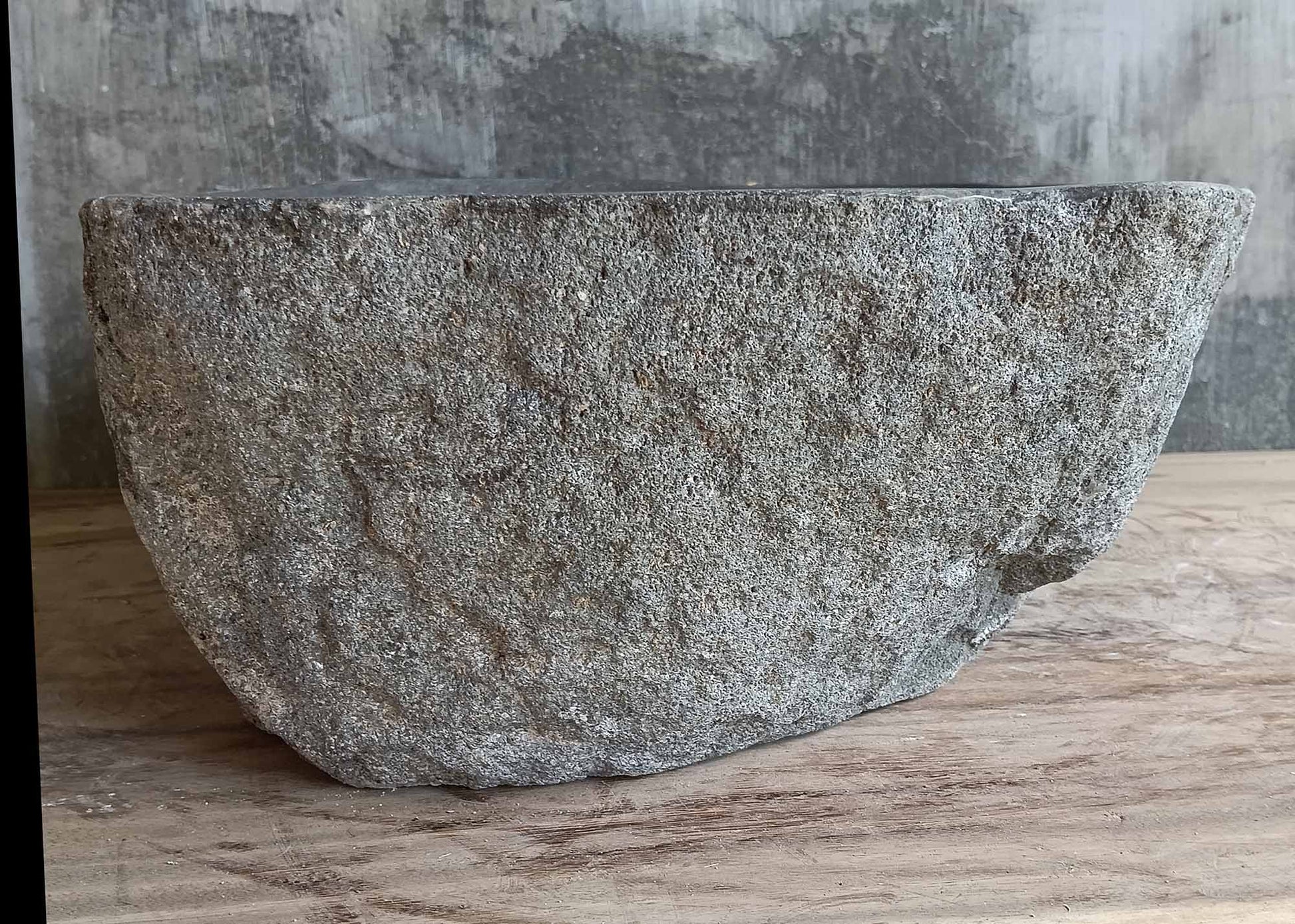 Rear view highlighting the chiseled back of the stone sink