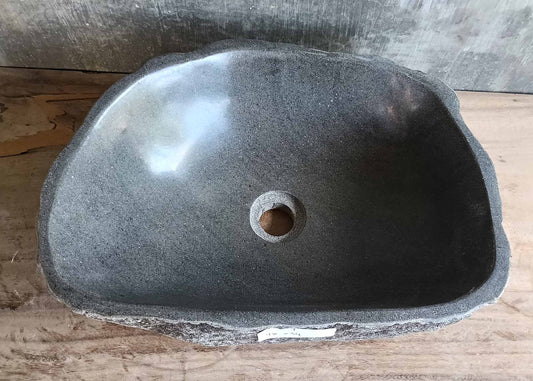 Top view of polished interior bowl in dark gray stone