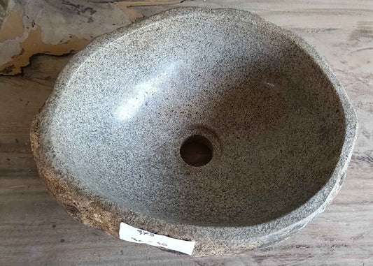 Top view of 14×12 inch handcrafted river stone sink with light beige interior and oval shape
