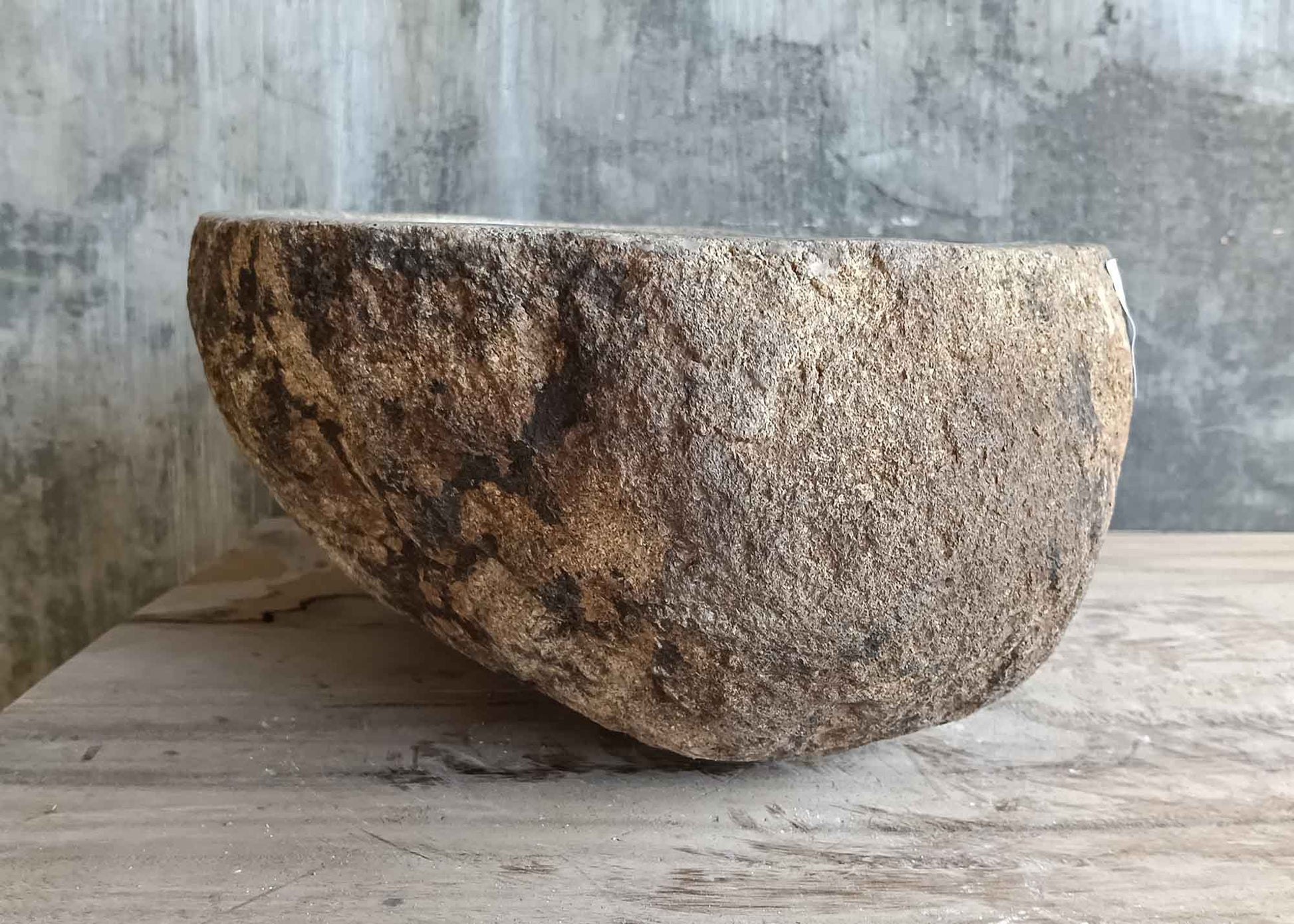 Right side view of 14×12 inch light beige river stone sink showing raw stone finish
