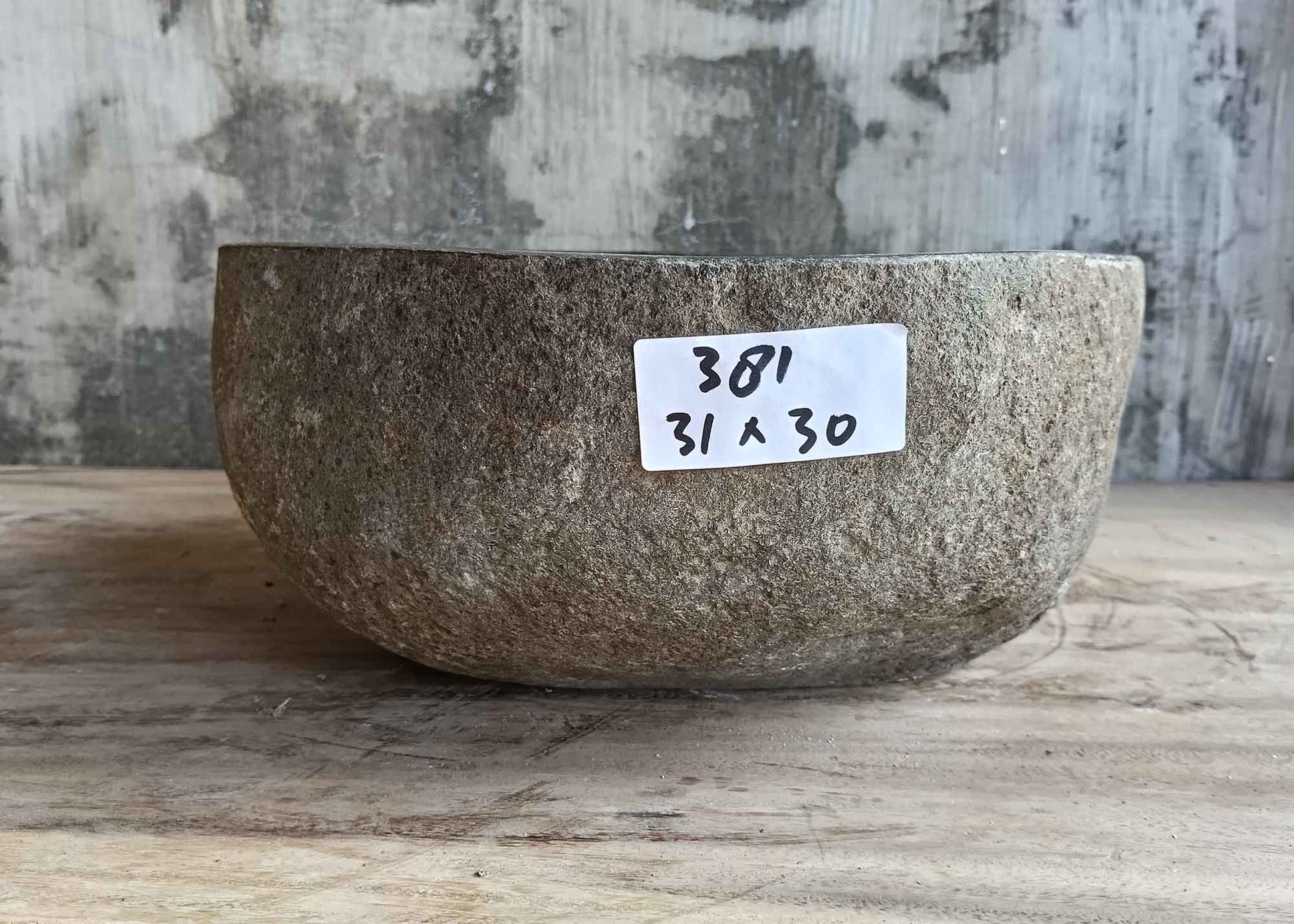 Front side of 12×12 inch dark gray river stone sink showing raw natural surface
