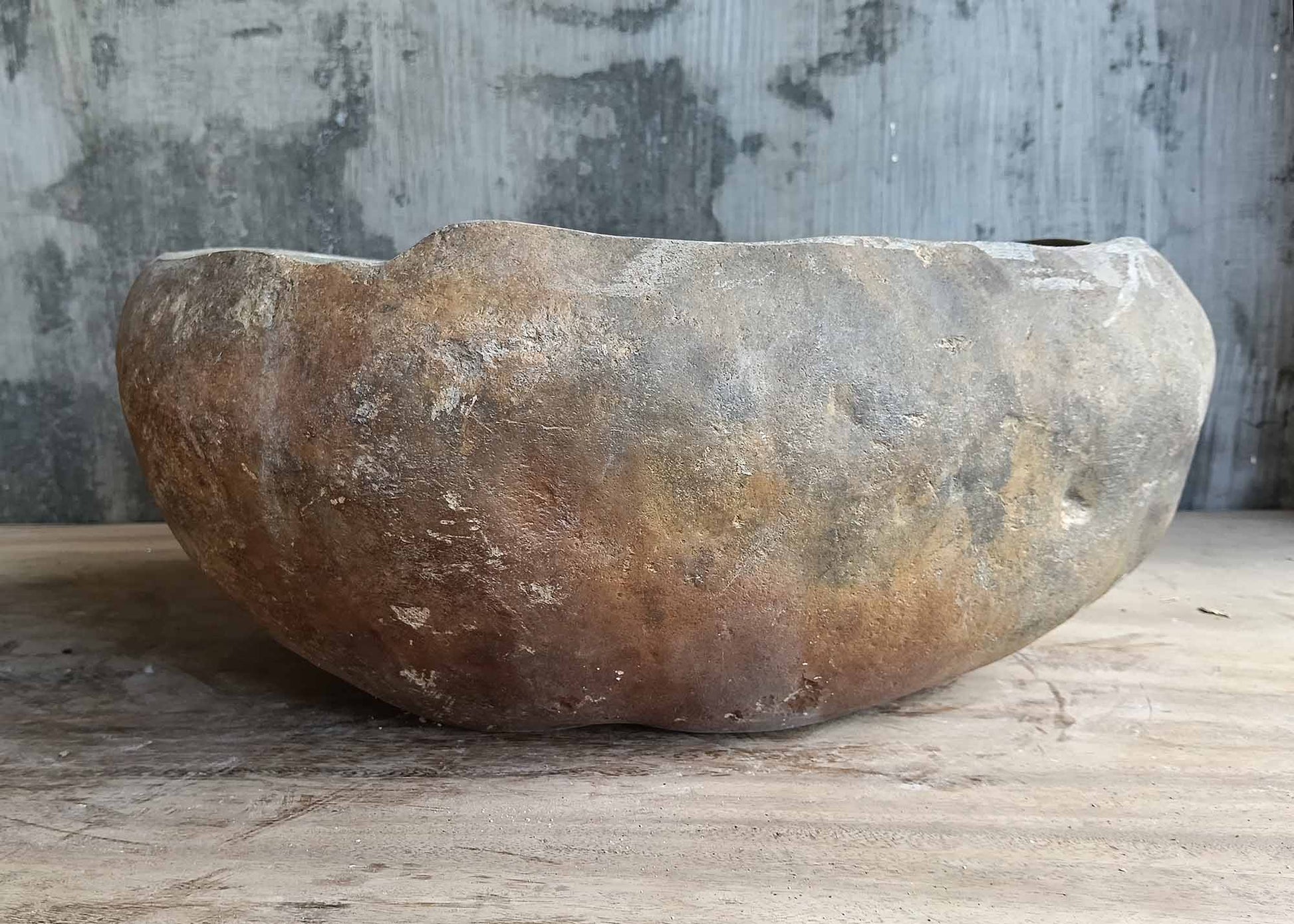 Handcrafted brown river stone basin – back view
