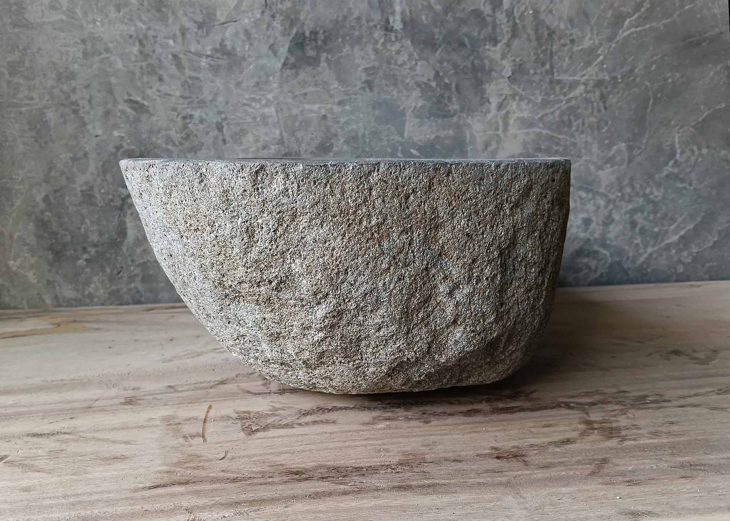 Raw sculpted river stone basin – right view
