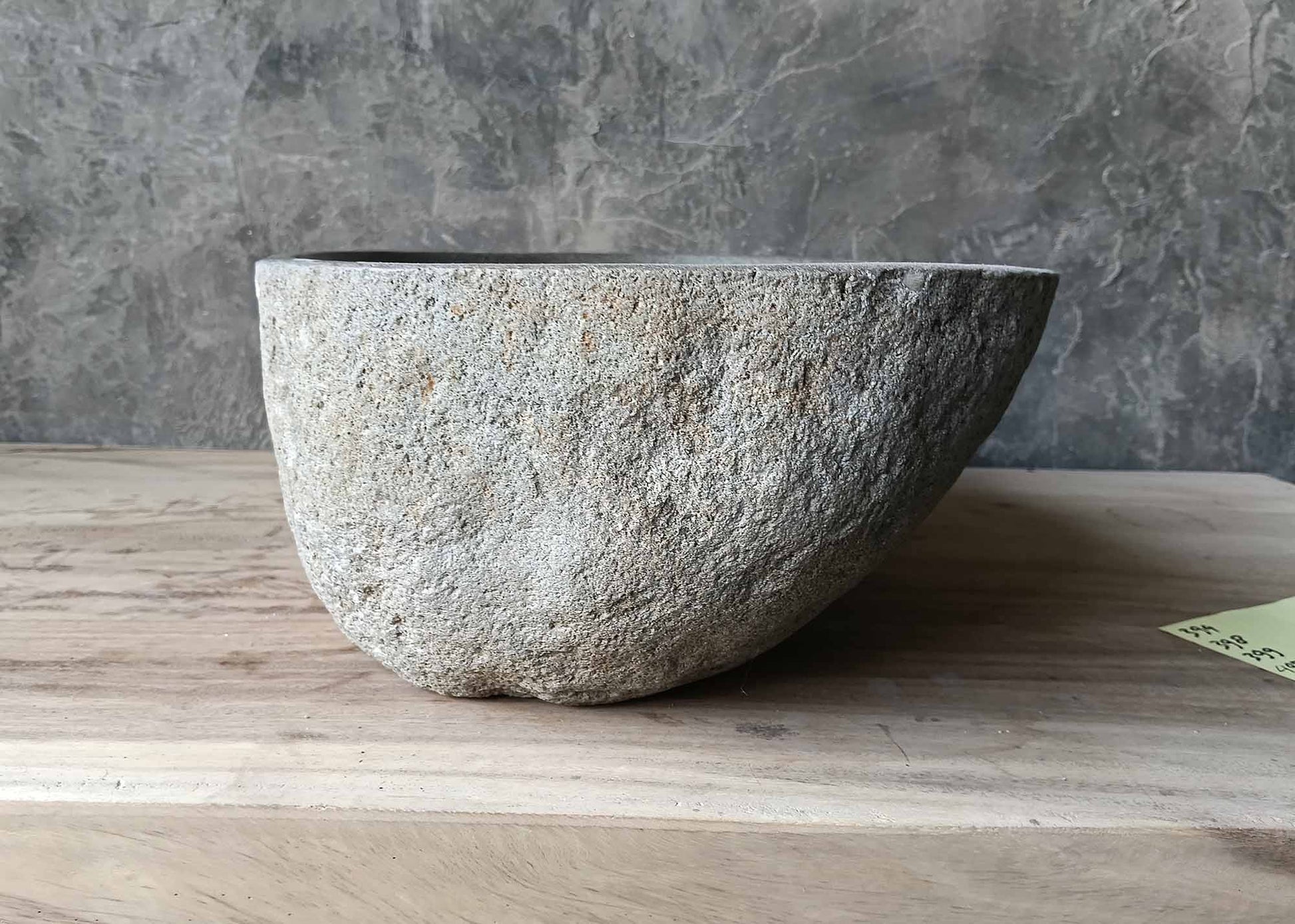 Grainy texture boat-style river stone sink – left side view
