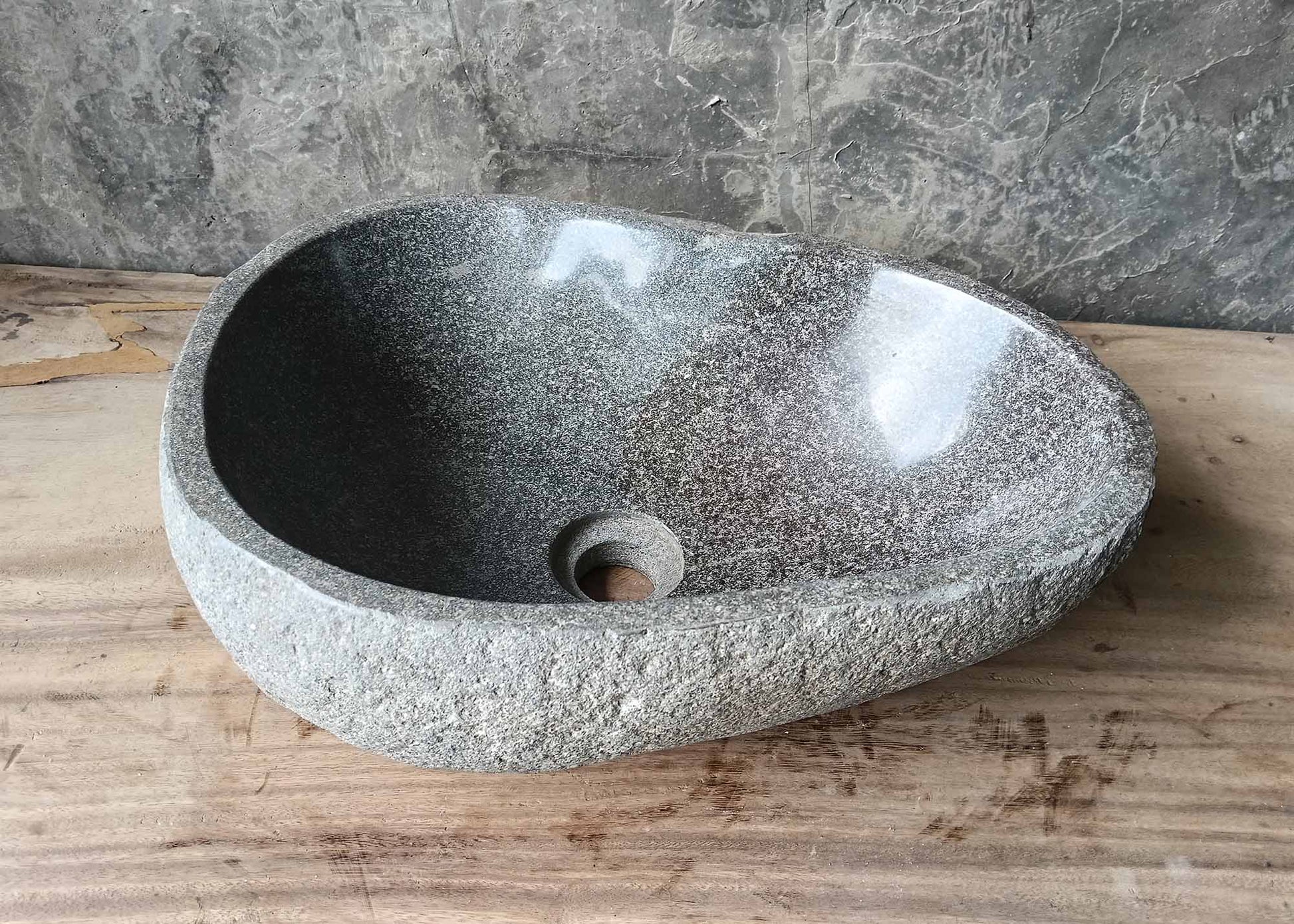 Back surface of handcrafted sink showing organic texture and color
