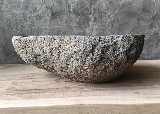 Sculpted edge natural grain stone basin – front view
