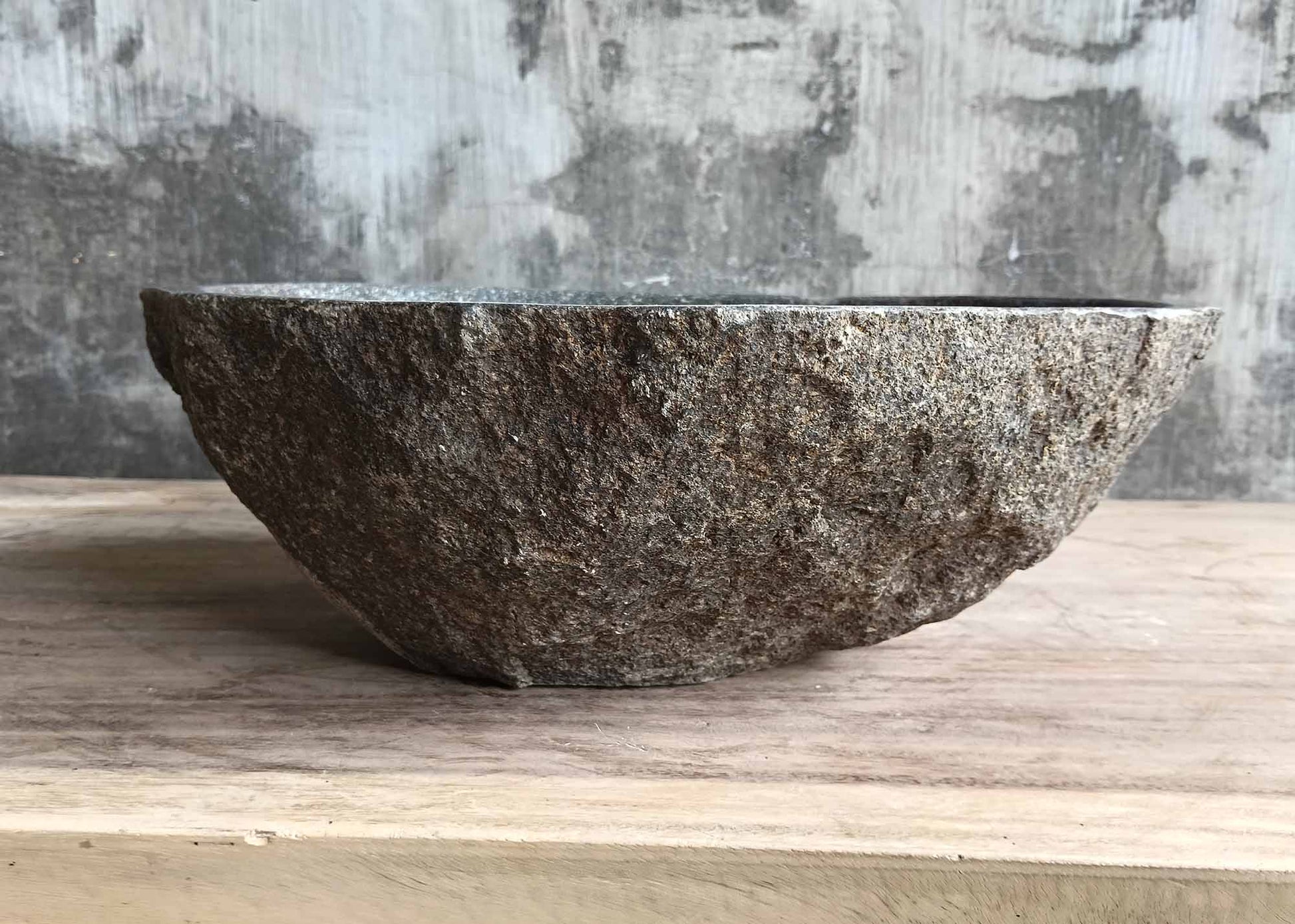 Hand-sculpted rustic stone basin – back view
