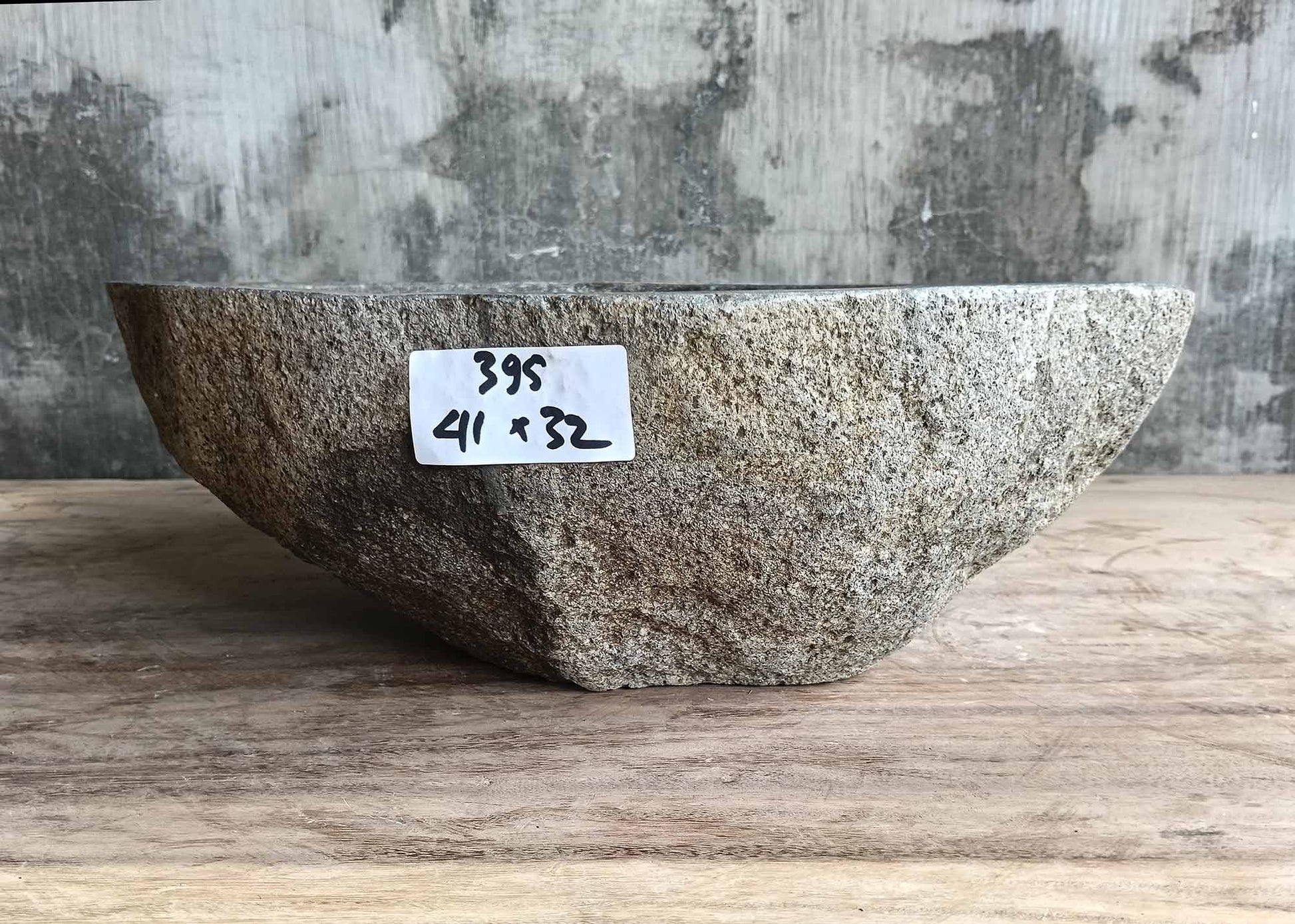 Organic contour stone sink with earthy texture – front view

